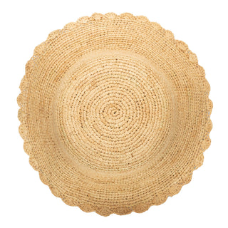 Top of  tan crochet bucket hat with a scalloped brim. 