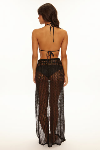 Woman wearing a black lace outfit on a white background